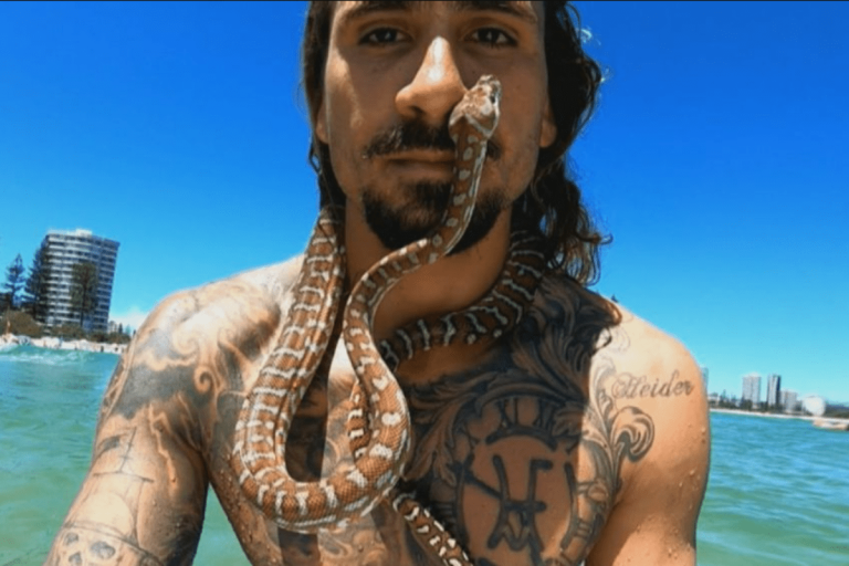 Australian Man Takes His Pet Python Surfing