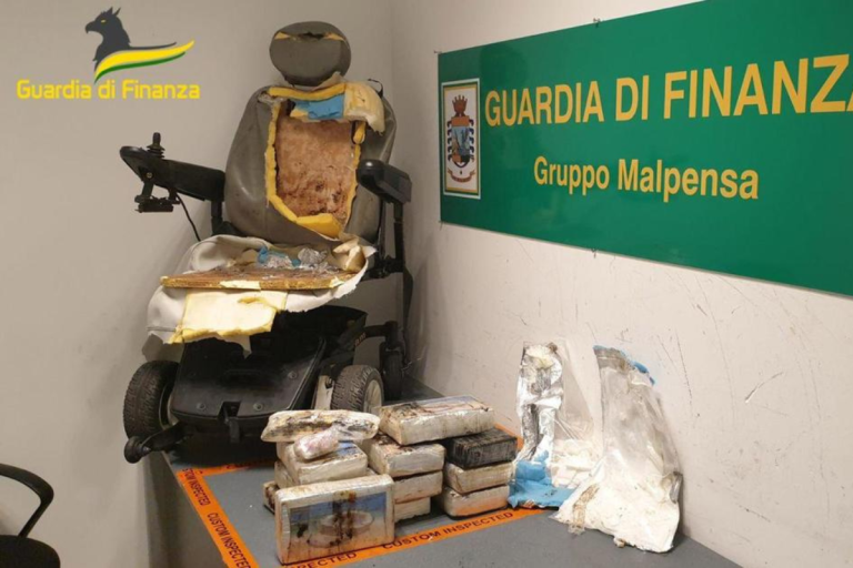 Drug-sniffing dogs find cocaine hidden in wheelchair, as man gets up and tries to walk away